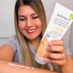 Derma E hand applying lotion demonstrating instant softening benefit