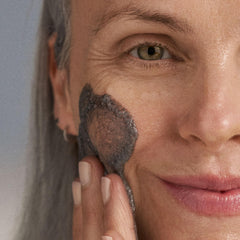 Dermalogica powder being mixed with water into a creamy paste for fresh activation