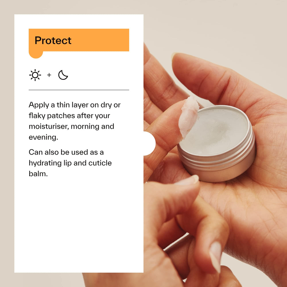 Dermatica balm on fingers being applied to skin offering targeted hydration