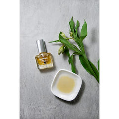 Dermelect brush applicator applying oil, enables precise cuticle treatment and control