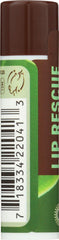 Desert Essence lip rescue shown in hand to illustrate compact travel size