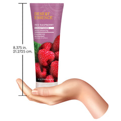 Desert Essence bottle held next to hand showing 8 fl oz scale and travel-friendly benefit