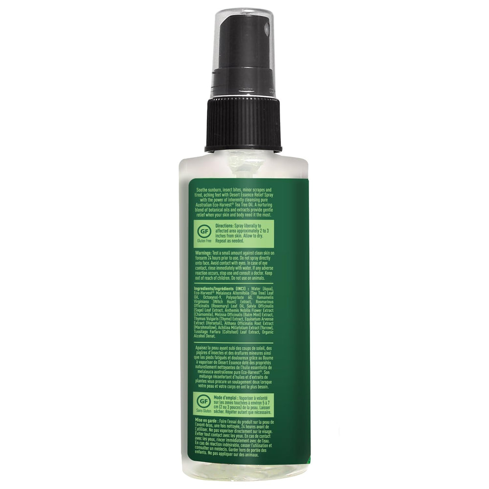Desert Essence bottle beside travel items showing portable size