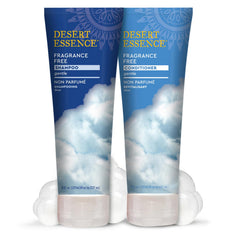 Desert Essence next to common objects to show 8 fl oz size and portability