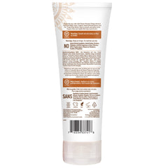 Desert Essence lotion texture on fingertip, shows lightweight absorption and smooth feel