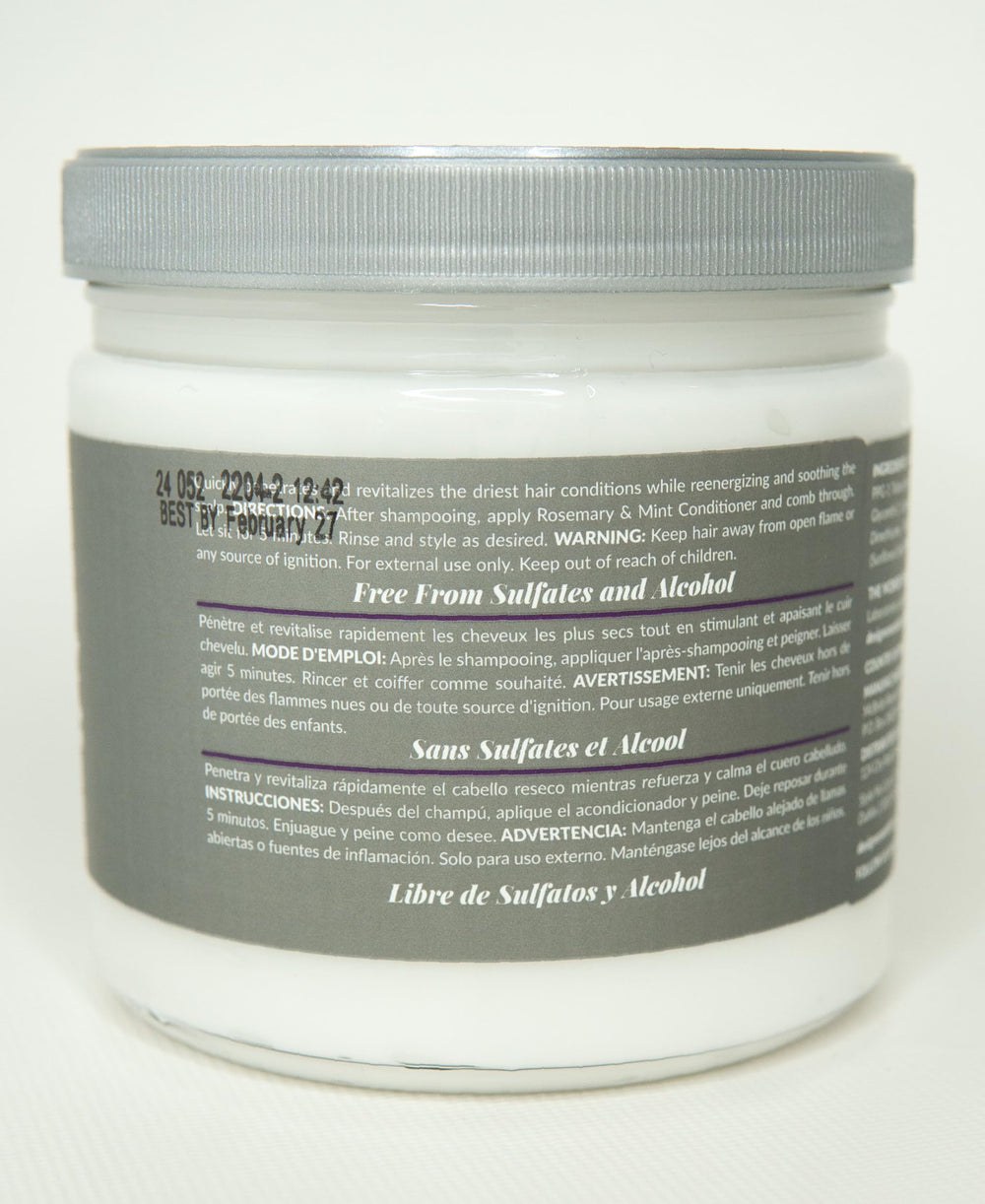 Design Essentials conditioner on hand being applied, soothes scalp and moisturizes