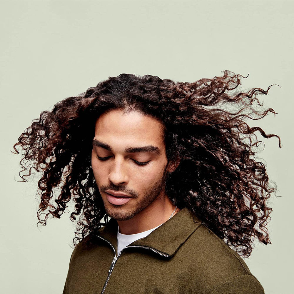 DevaCurl One Condition Decadence beside ruler to show the 32 fl. oz. scale and value