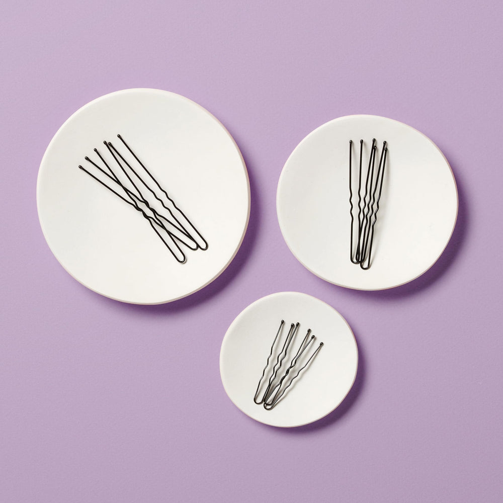 Diane hair pins securing a bun updo for event-ready hold