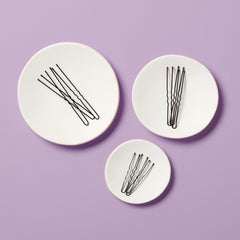 Diane hair pins securing a bun updo for event-ready hold