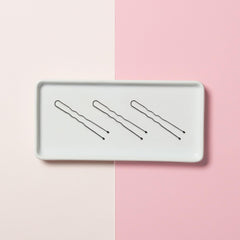 Diane pins next to ruler showing 1.75 inch length and 300-count supply