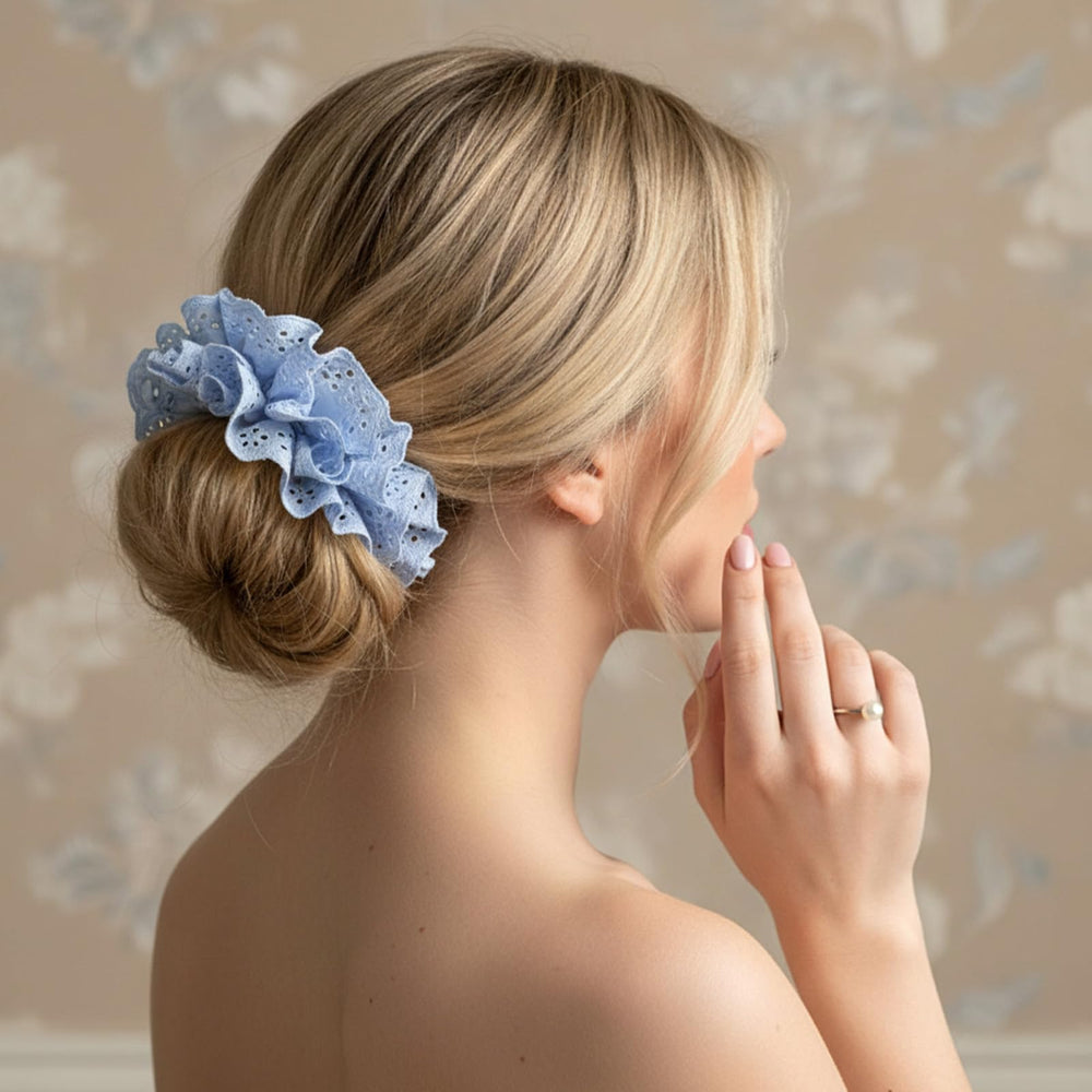 Dimeho scrunchie used in a high bun showing lift and decorative finish