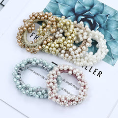 Dizila open gift-style box with packed pearl hair ties ready to present
