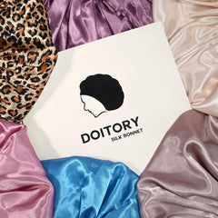Doitory bonnet on bedside pillow demonstrating overnight hair moisture preservation
