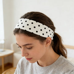 Doneace headband next to hand showing scale and easy packing benefit