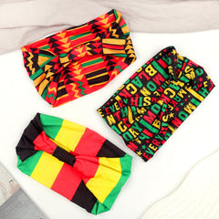 Doneace three headbands stacked to display red yellow black green coordination
