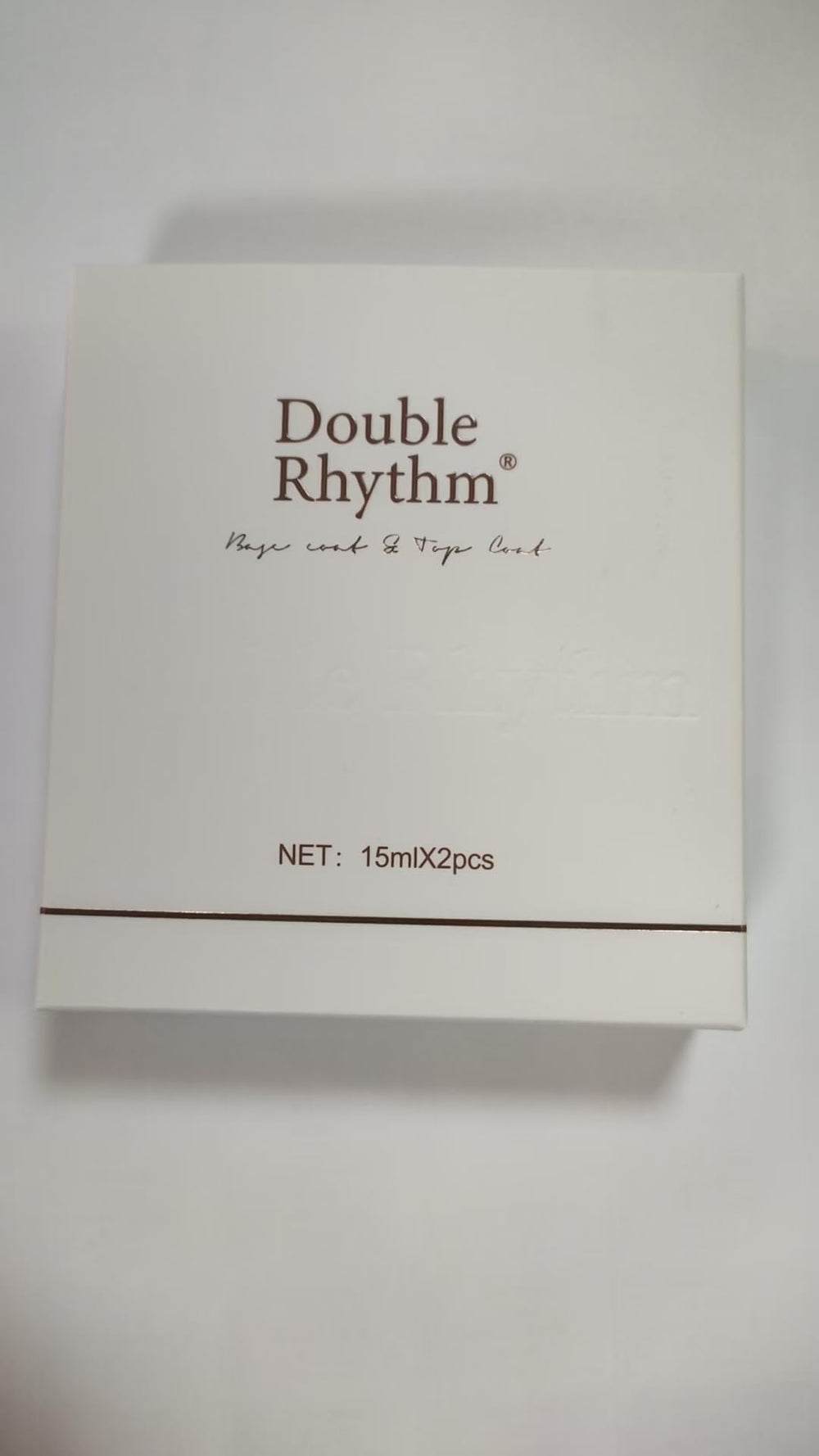 Hands holding a gift-wrapped box with Double Rhythm set suggesting ideal present for nail lovers