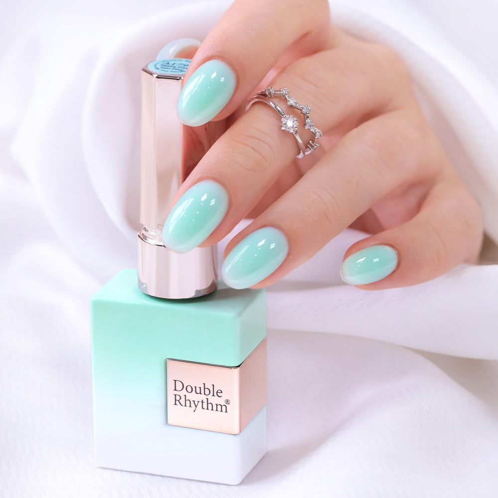 Double Rhythm front view of milky teal bottle showing shade and benefit of translucence