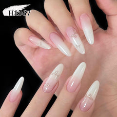 Double Rhythm swatch on nail tip showing milky white translucence and buildable coverage