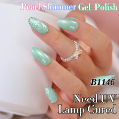 Double Rhythm painted nail tip showing cured pearl green shine and durable salon finish