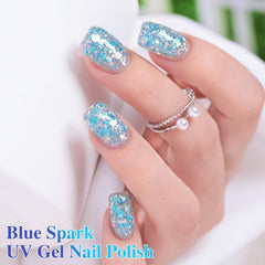 Hand with nails painted in Double Rhythm Sparkle Blue showing salon-quality finished look