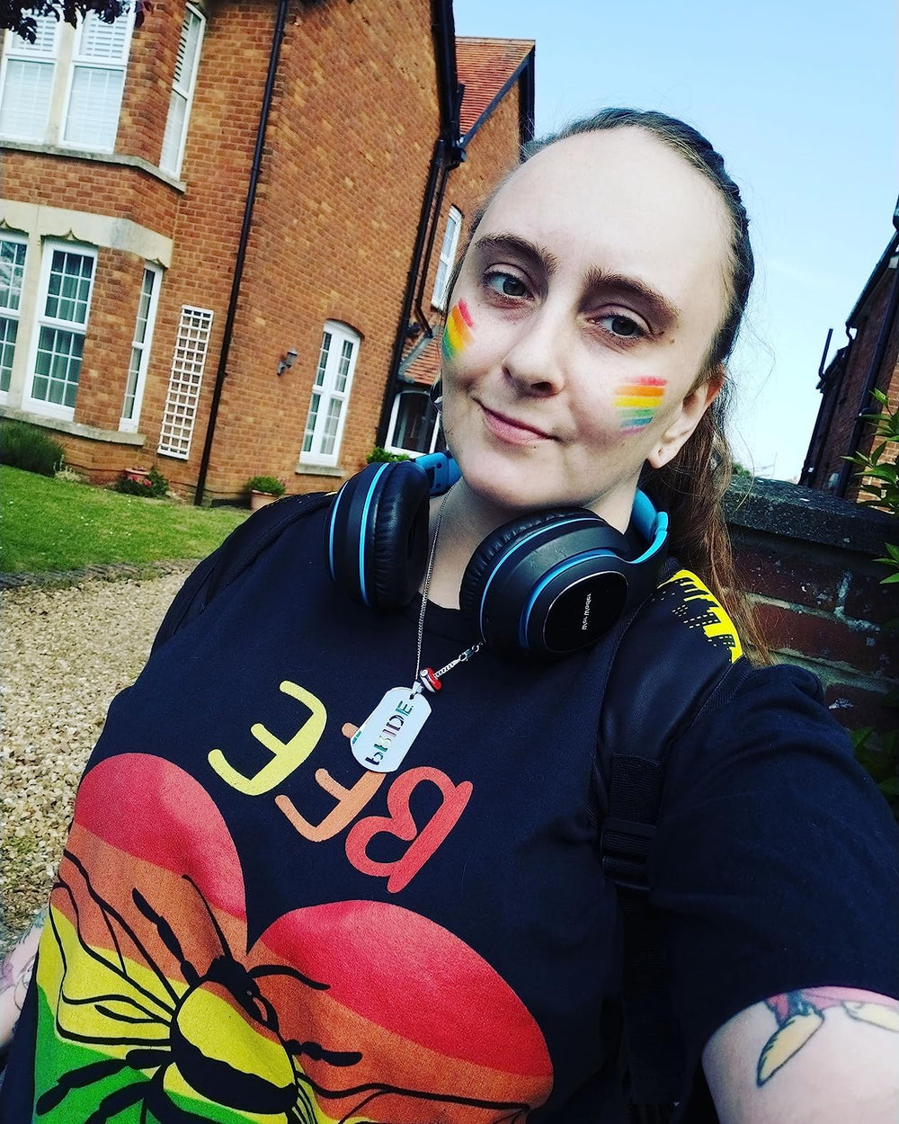 DoubleWood applied cheek stripes demonstrating bright rainbow design for celebrations