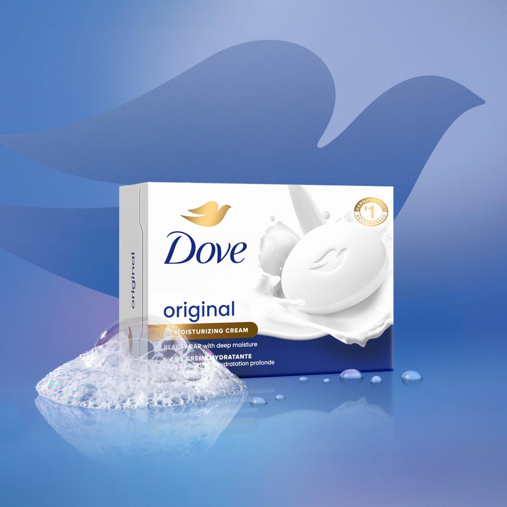 Hand holding Dove bar while washing showing gentle cleansing action