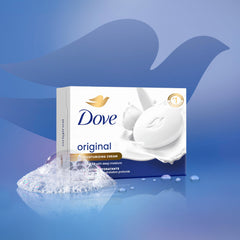 Hand holding Dove bar while washing showing gentle cleansing action