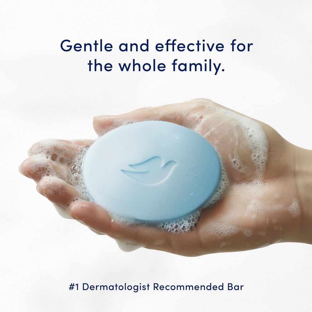 Hand holding Dove beauty bar creating creamy lather for effective wash