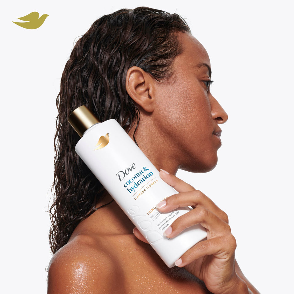 Dove coconut oil ingredient visual emphasizing moisturizing benefit