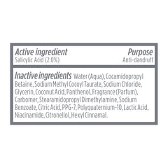 Dove Derma Scalp bottle on bathroom shelf among toiletries, suggesting routine use