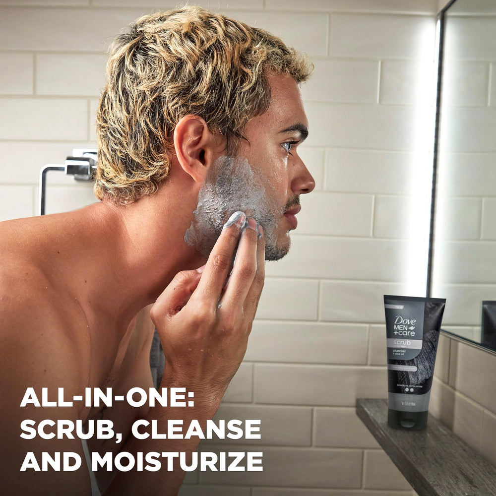 DOVE MEN + CARE 9 oz tube held in hand to show real size and portability