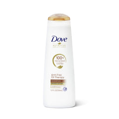Dove front packaging showing Oil Therapy shampoo and clear product benefit