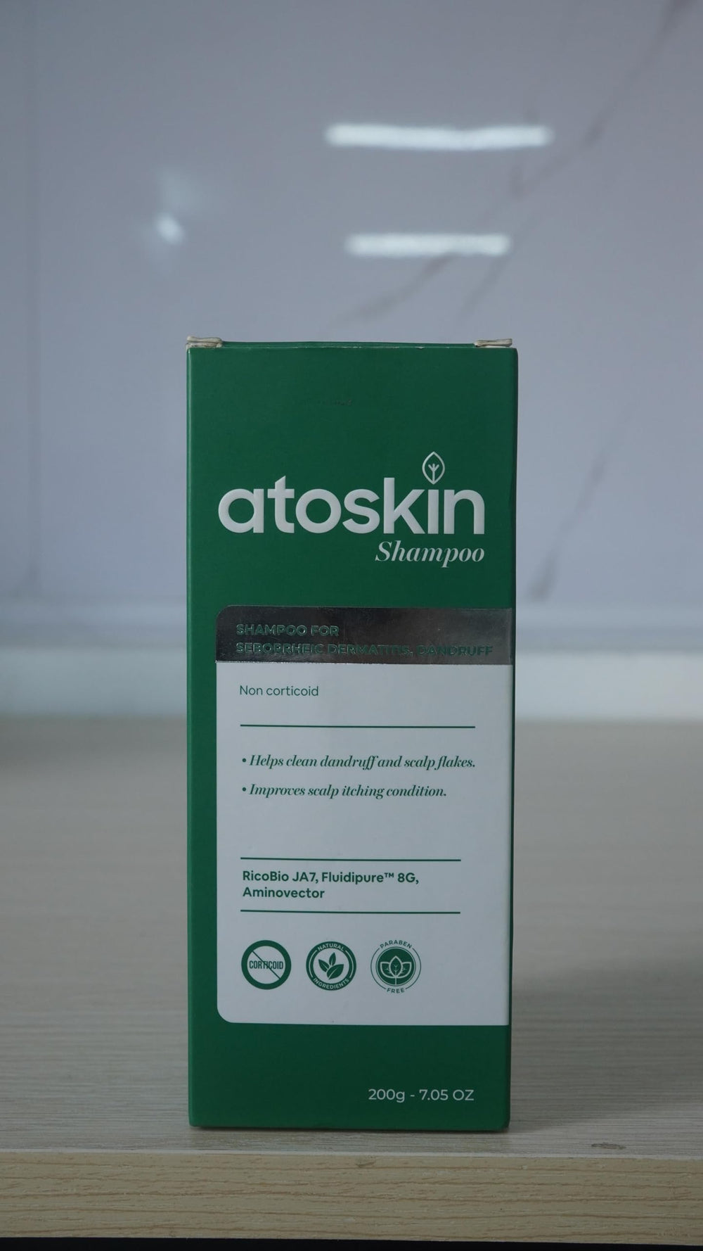 dr.atoskin before and after scalp visual indicating fewer flakes and calmer skin