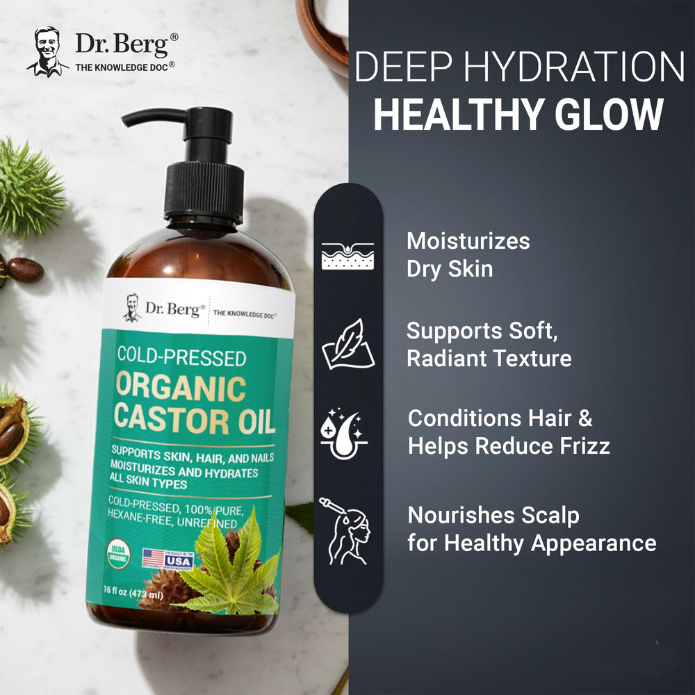 Dr. Berg applying oil to hair roots to nourish scalp and improve manageability