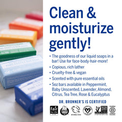 Dr. Bronner's bars held in hand showing 5 oz scale and convenient everyday size