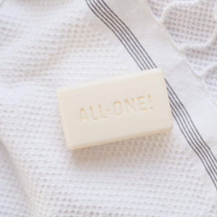 Dr. Bronner's soap lathered in hands demonstrating rich foam and easy rinsing benefit