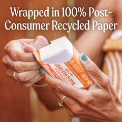 Dr. Bronner's tea tree bar on bathroom shelf suggesting sustainable daily use