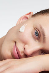 Dr. Hauschka cream on hand demonstrating spreadability and moisturization