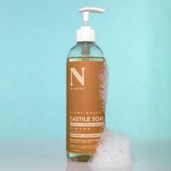 Dr. Natural bottle beside kitchen sink showing eco cleaning versatility