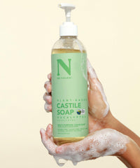 Dr. Natural creating shampoo lather in hair showing clarifying yet hydrating wash