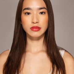 Dr. PAWPAW ORIGINAL BALM applied on lips demonstrating moisturized, natural-red finish