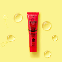 Dr. PAWPAW ORIGINAL BALM in a handbag with mirror illustrating on-the-go touch-up benefits