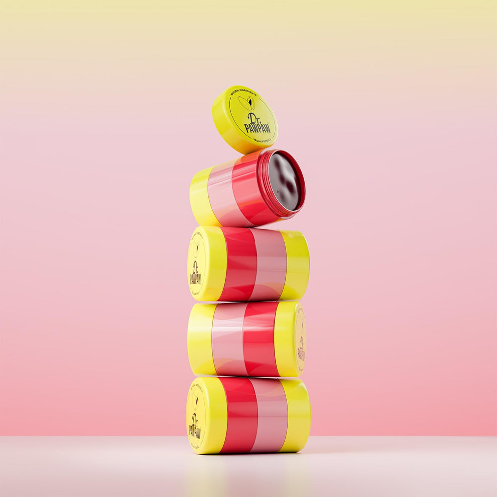 Dr. PAWPAW ORIGINAL BALM applied outdoors on a model showing everyday lip comfort