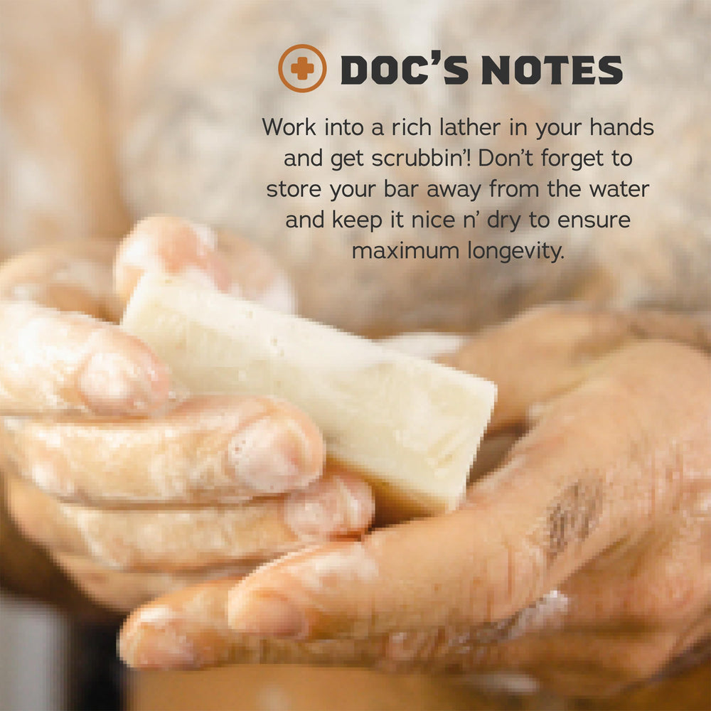 Dr. Squatch soap bar held in hand showing 5 oz size and travelability