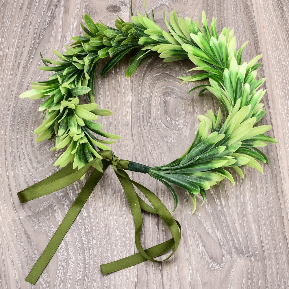 DreamLily crown held in hand shows size and lightweight benefit