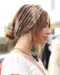 DRESHOW headband worn at forehead showing secure hold and style