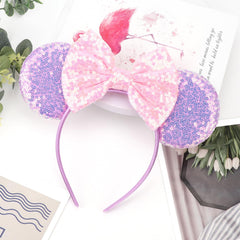 DRESHOW headband worn at a theme park, adds playful sparkle to outfits