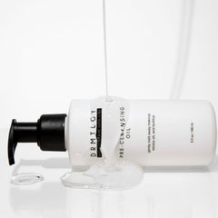 DRMTLGY 5 fl oz bottle next to common items for size comparison
