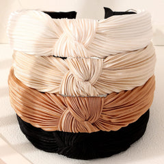 Drnytunk headband beside hand showing true size and scale