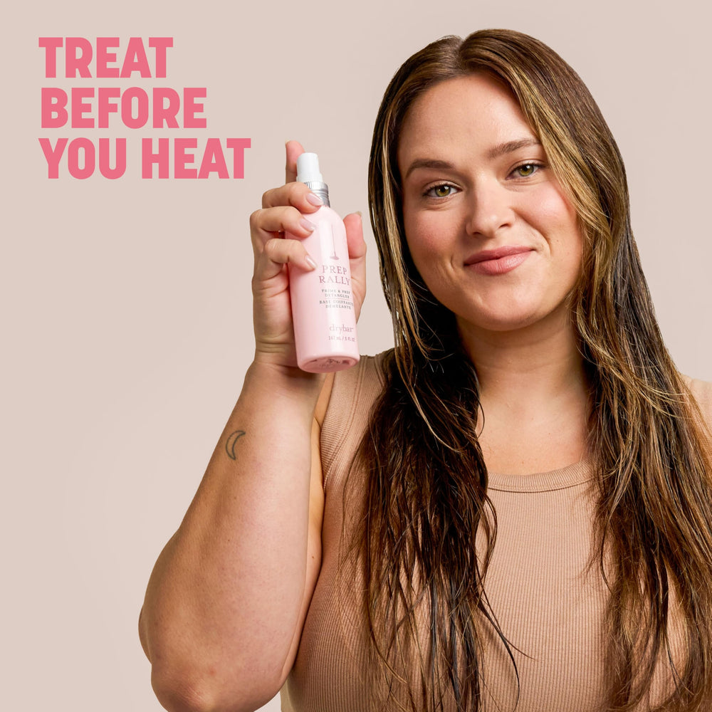 Drybar bottle placed beside brush showing improved styling slip benefit